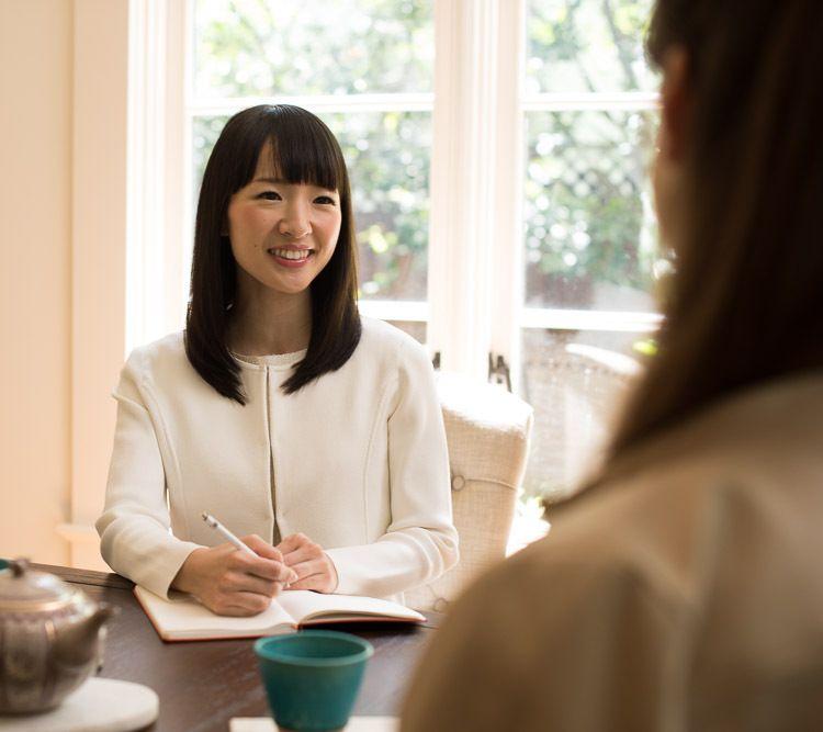 Marie Kondo providing consulting services to a client
