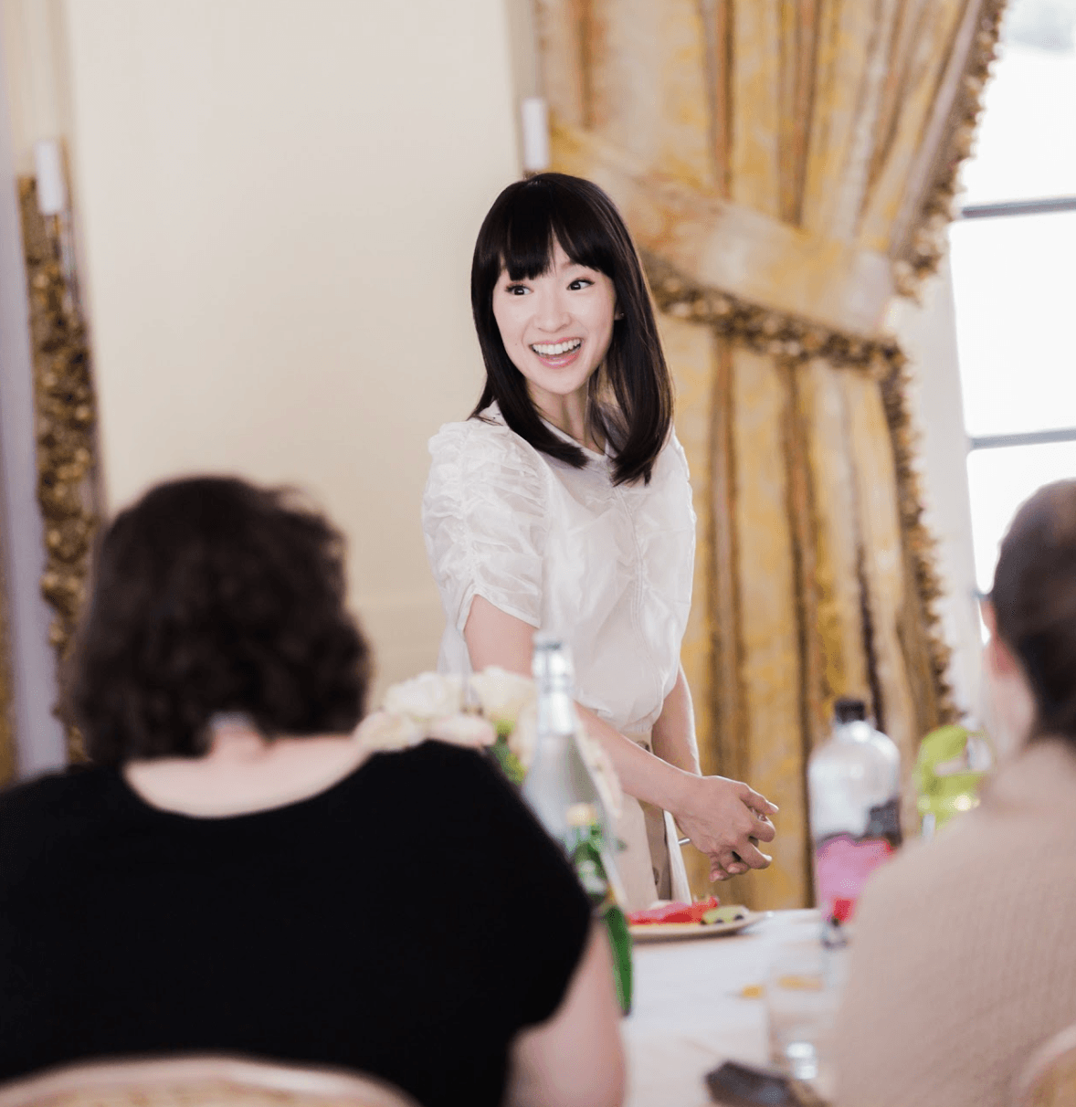 Marie Kondo providing consulting services to a client