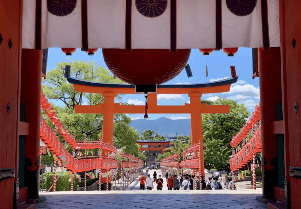 Fushimi Inari shrine and its iconic large red torii gates and lanterns on both sides
