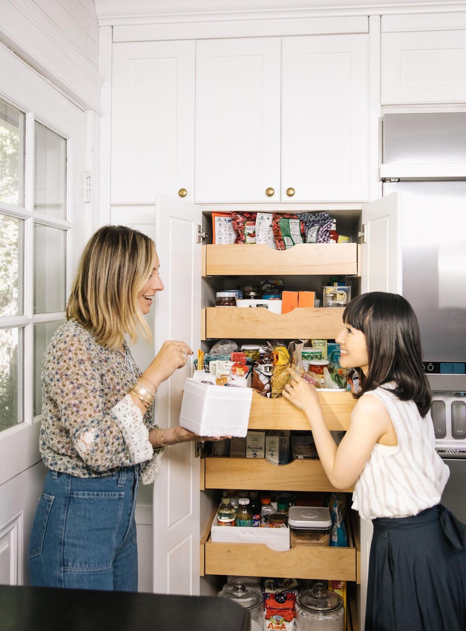 Marie Kondo working with a client on her pantry