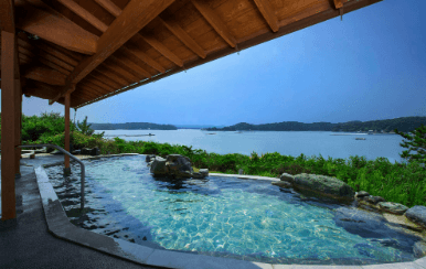 The stunning outdoor onsen with a waterfront view