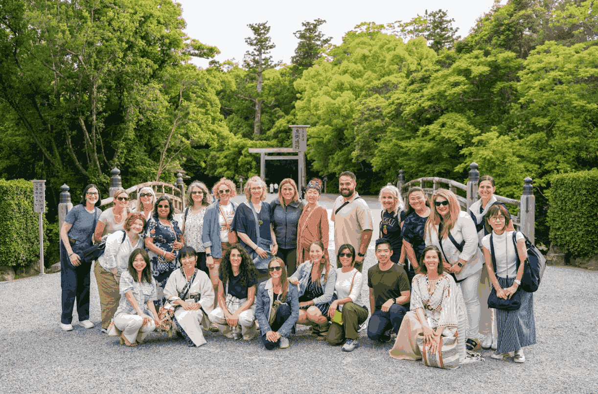 KonMari Consultants gather in a group photo in Ise, surrounded by its stunning greenery.